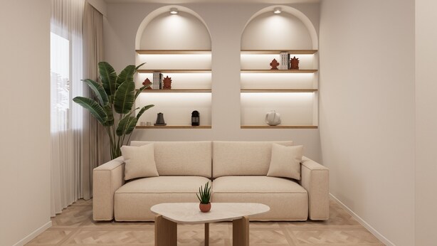 Un salon moderne comprenant un canapé, une table basse et des étagères ornées d’objets décoratifs.
