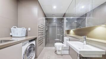 Shower, hair dryer, towels, shampoo