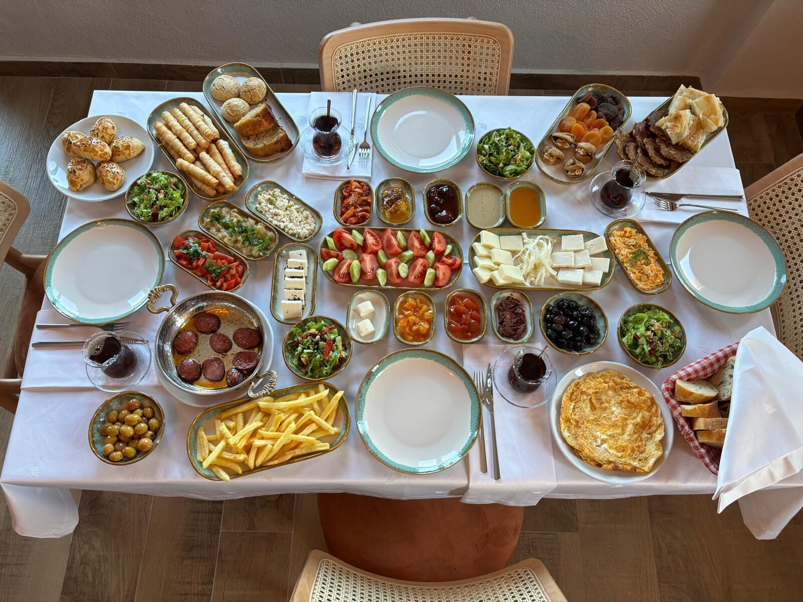 A table set with various dishes and condiments, indicating a meal setting.