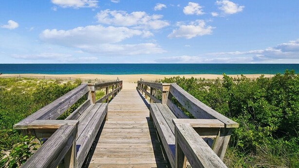 A wooden boardwalk leading to a beach with a clear sky. - 29532 N. Cotton Way - Cotton Patch East (Bethany Beach)