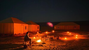 A desert scene with tents and a campfire. - starlitdesertcamp (Foum Zguid)