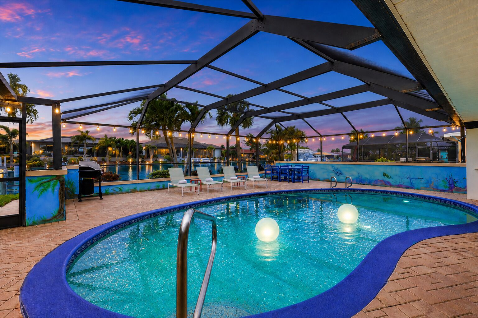 An indoor swimming pool with lounge chairs and a covered area.