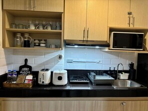 Economy Apartment | Private kitchen - Dela Serna Home (Taguig)