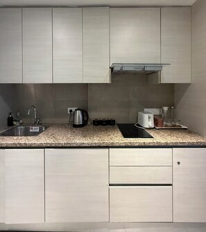 Fridge, microwave, oven, stovetop - Skynest – Luxe Modern Studio in Gurugram, India (Gurugram)