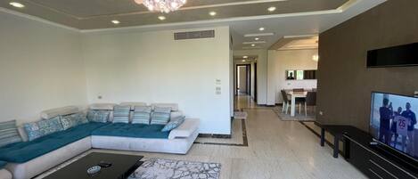 Deluxe Apartment, Private Bathroom, Garden View | Living area