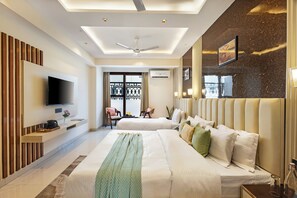 A hotel room with a large bed, a TV, a balcony, and a modern ceiling design. - Anandam in the Himalyas By Alaya Stays (Rishikesh)