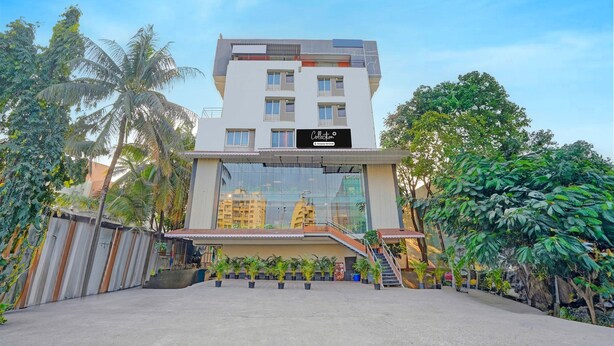 A modern building with a sign reading 'Collection.' - Classic With Balcony I- Siri Lodge (Pune)