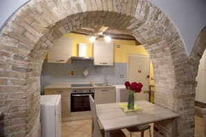 Private kitchen - Cozy suite in the heart of Perugia, perfect for 2 guests.Elegant room, comfortable living room and kitchen equipped to feel right at home.The unique detail? The natural stone walls, which give charm and character to the environment.Bright and well-kept,  (Perugia)