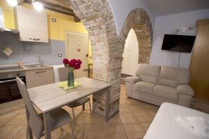 Interior - Cozy suite in the heart of Perugia, perfect for 2 guests.Elegant room, comfortable living room and kitchen equipped to feel right at home.The unique detail? The natural stone walls, which give charm and character to the environment.Bright and well-kept,  (Perugia)