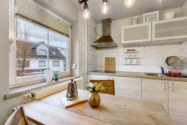 Fridge, microwave, stovetop, coffee/tea maker