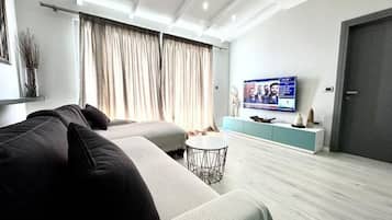 Apartment, Balcony, Sea View | Living area | TV