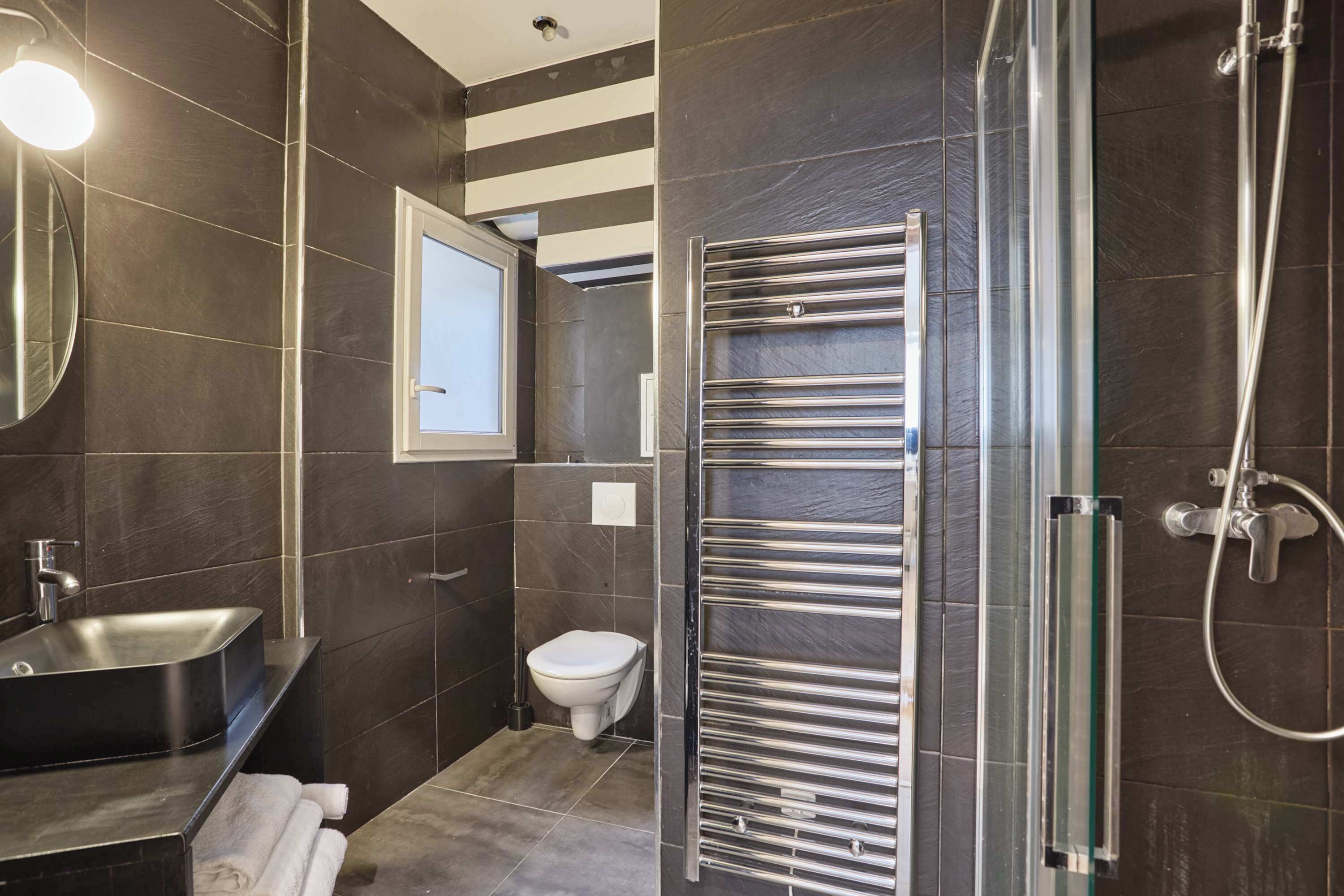 Shower, hair dryer, towels, shampoo