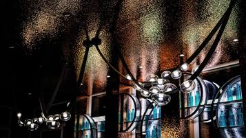A chandelier with multiple spherical light fixtures suspended from the ceiling.