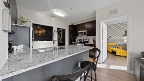 Fridge, microwave, oven, stovetop - Stylish 2BR Corporate Stay | Pool + Balcony #2 (Tampa)