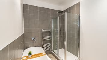 Shower, hair dryer, towels, shampoo