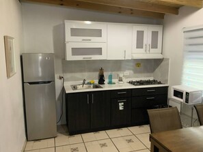 Fridge, stovetop, coffee/tea maker, highchair