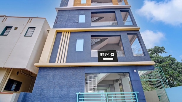 A multi-story hotel with a modern design, featuring a prominent 'HOTEL' sign on the facade.