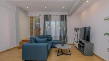 Deluxe suite, uitzicht op binnenplaats | Woonruimte