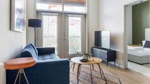 Standard Apartment (2 Bedrooms) | Living area | 50-inch Smart TV with digital channels