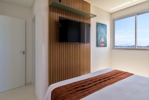 2 dormitorios, tabla de planchar con plancha, ropa de cama