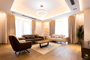 Apartament Deluxe, balcó, vistes a la ciutat | Sala d'estar