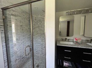 Shower, hair dryer, towels, soap