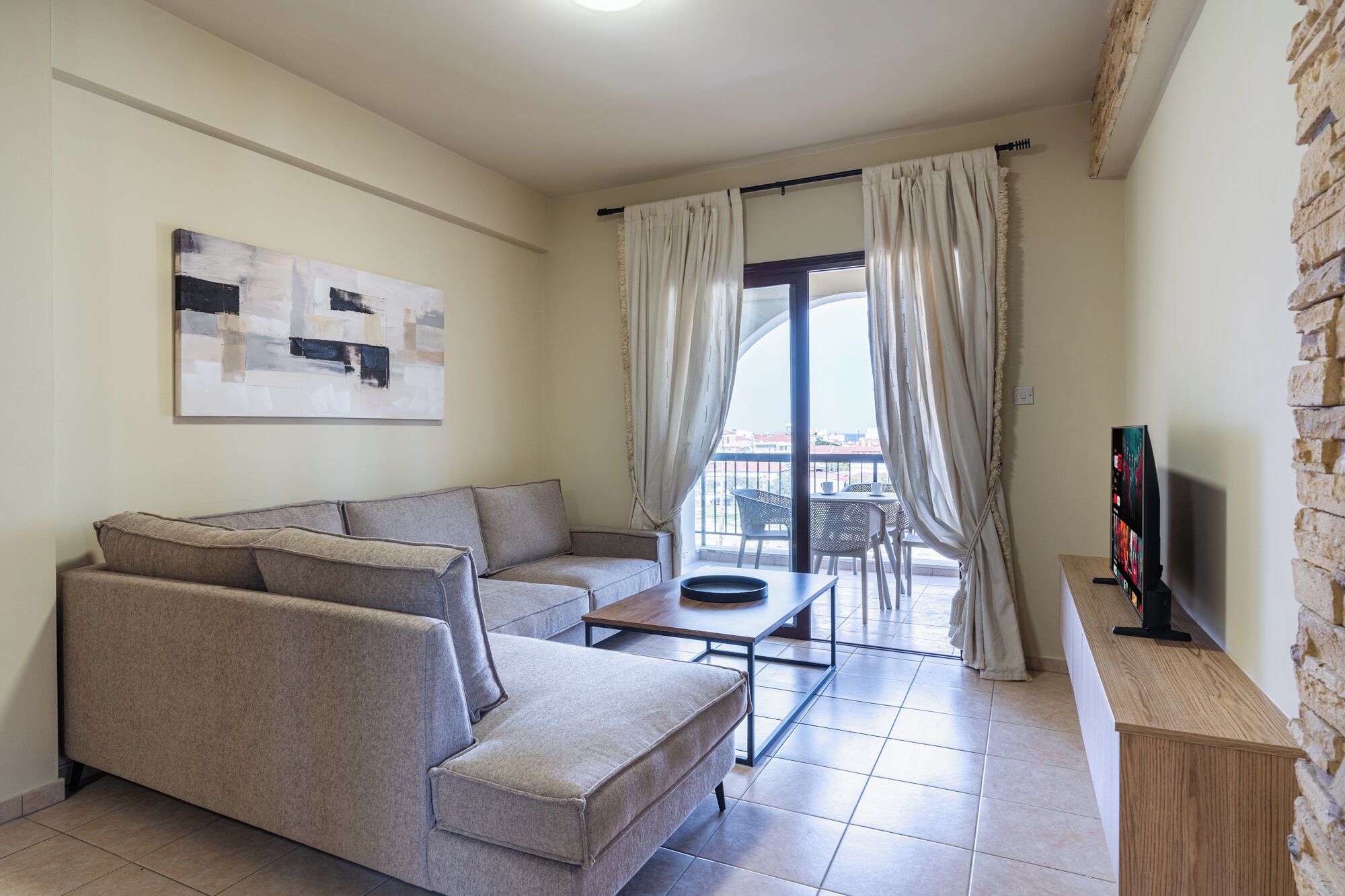 Apartment, Balcony, City View | Living area | 65-inch Smart TV with digital channels