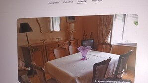 A computer screen displaying a webpage with a photo of a dining room.