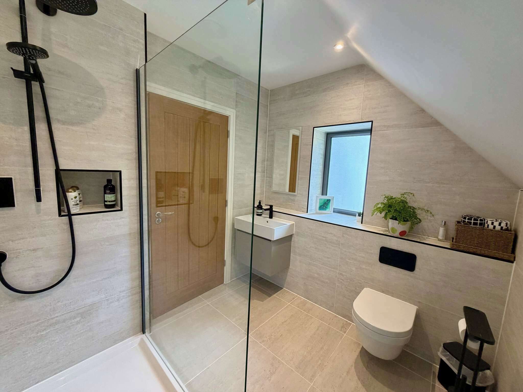 Shower, hair dryer, towels, shampoo