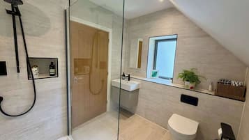 Shower, hair dryer, towels, shampoo