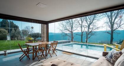 GuestHost - A modern and welcoming 165 square meters villa, perfect for six people. The property is a renovated barn and enjoys excellent views of the Piacenza hills and the city of Piacenza.Guests can enjoy a relaxing and peaceful stay, typical of this