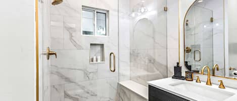 Shower, hair dryer, towels, shampoo