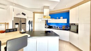 Coffee/tea maker, fridge, microwave, oven