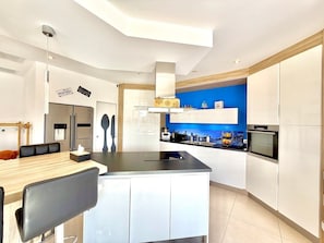 Coffee/tea maker, fridge, microwave, oven