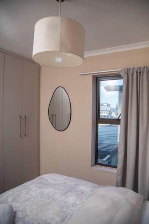Iron/ironing board, Internet, bed sheets - Beachside Modern Holiday Apartments (Cape Town)
