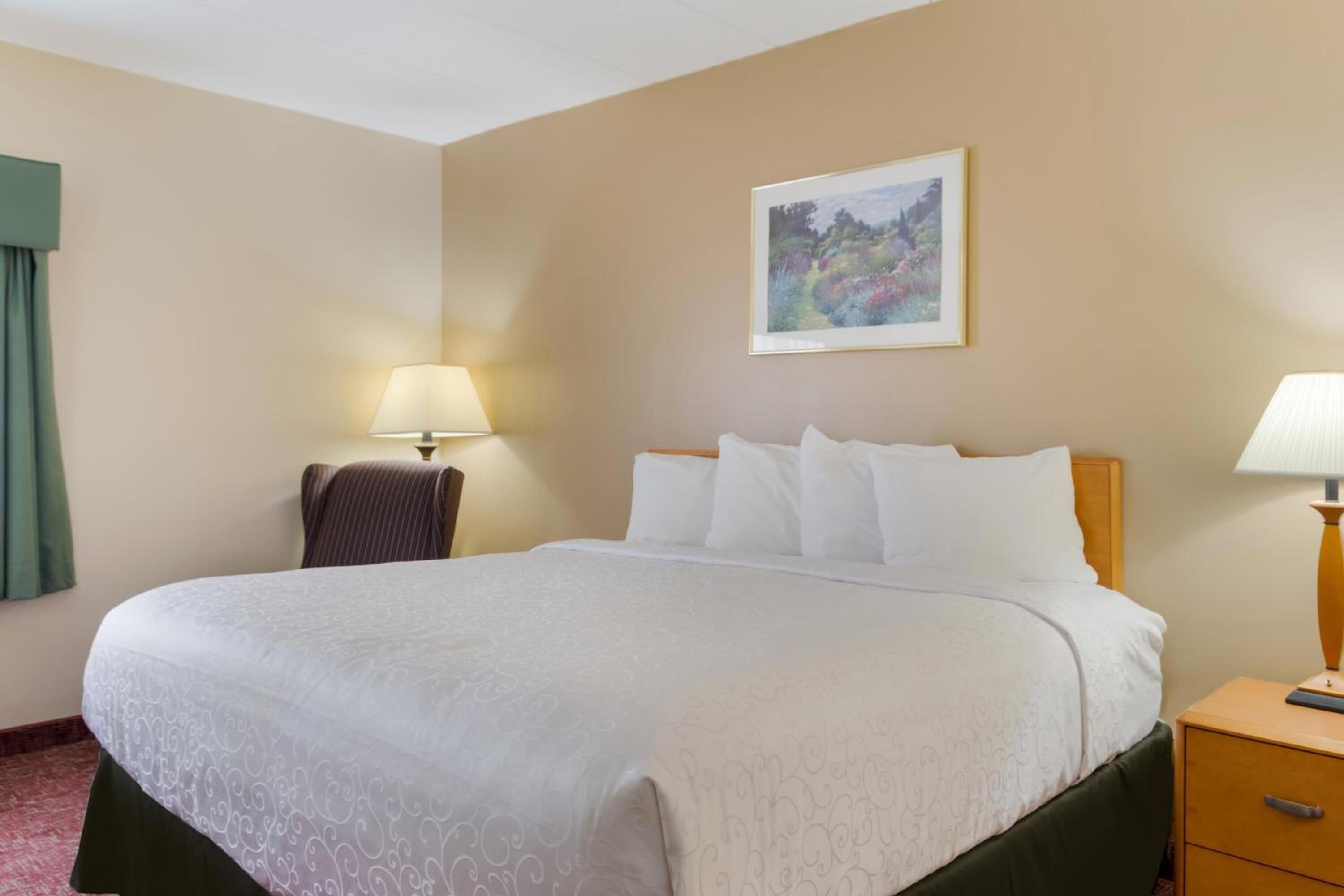 Relax into a serene sleep space with soft bedside lighting.