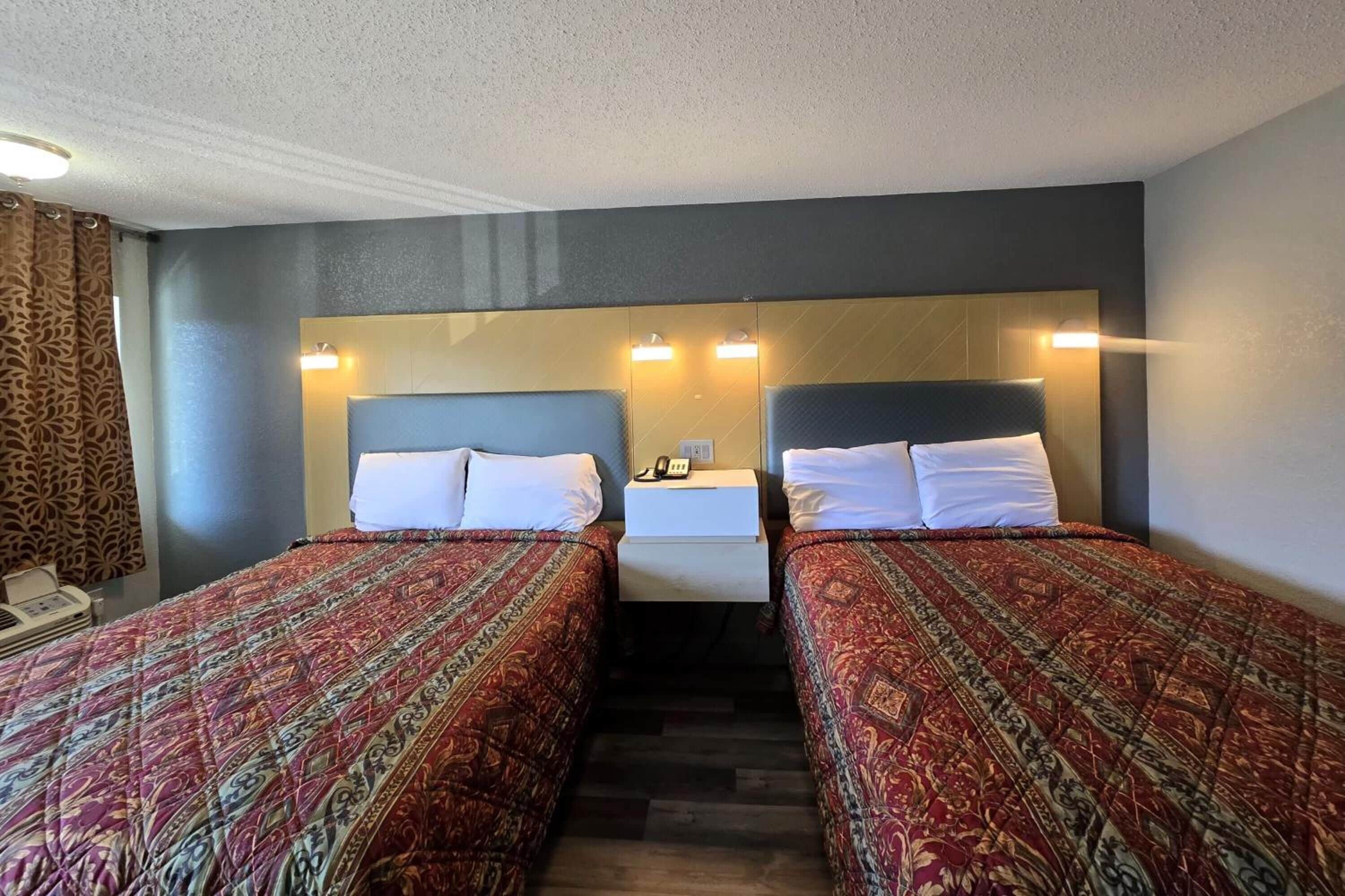 Settle into two comfy beds under warm, flattering lights.