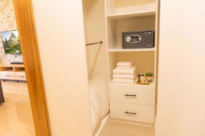 A hotel room with a minibar, a bed, and a bathroom. - Villa Shorys: Free Electricity | 12Pax | Pool+Jacuzzi | A/C | Covered Parking (Punta Cana)