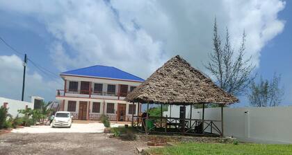 Karibu House Bwejuu.
A cool apartment to stay in and about 20 mins to the beach