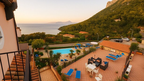 A pool area with lounge chairs, a table, and a staircase leading to an upper level. - MARATEA, sea view apartment with pool use, 700 meters from the sea. (Maratea)