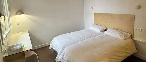 Basic Twin Room, Patio, Courtyard View | Desk, laptop workspace, blackout curtains, free WiFi