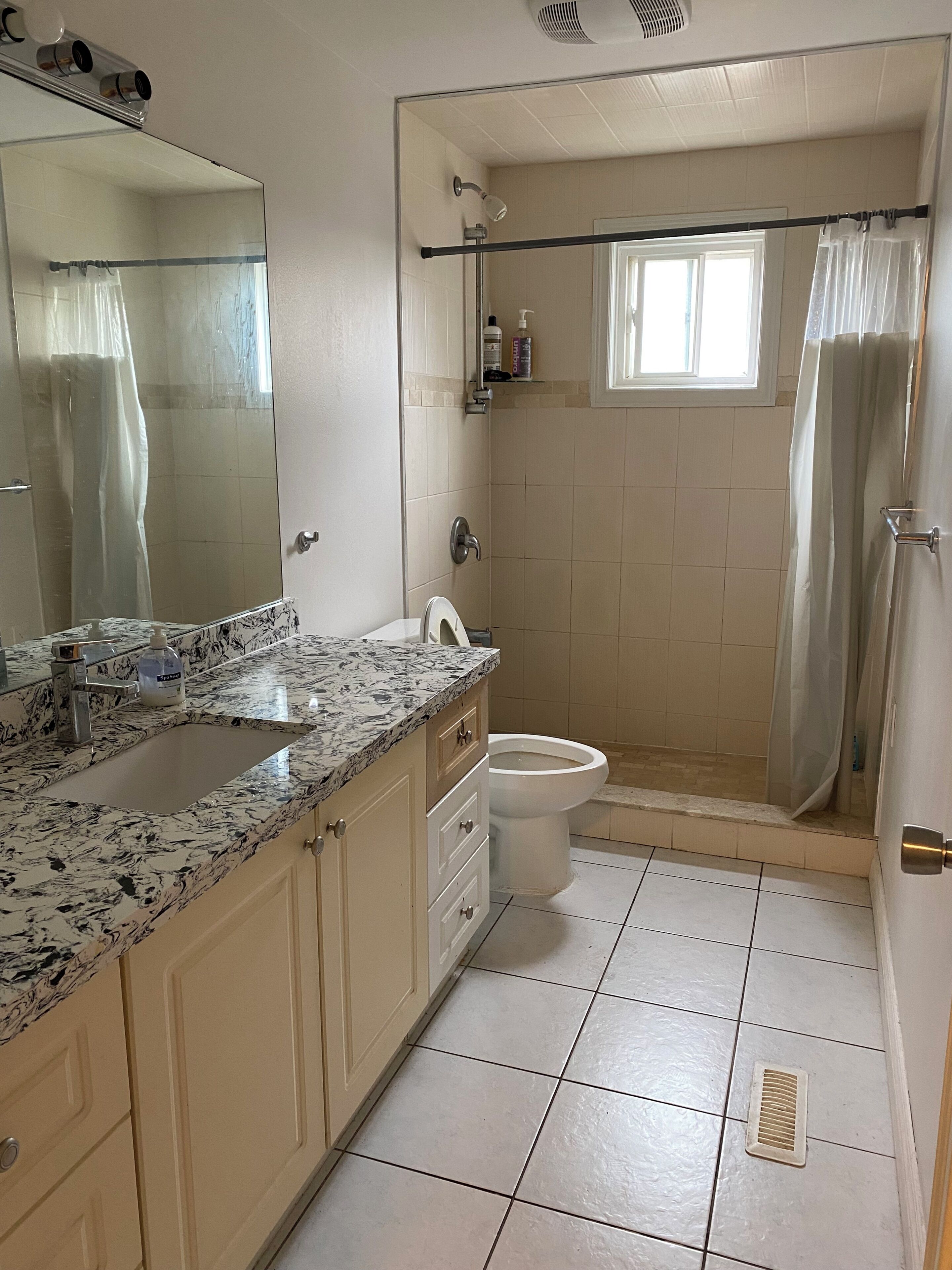 Shower, hair dryer, towels, toilet paper