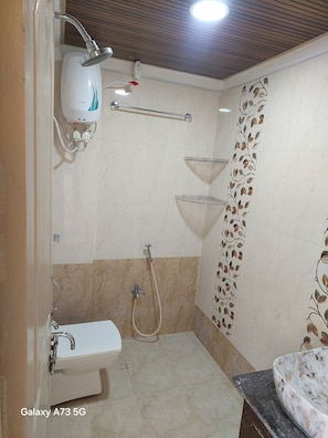 Shower, towels, soap, toilet paper