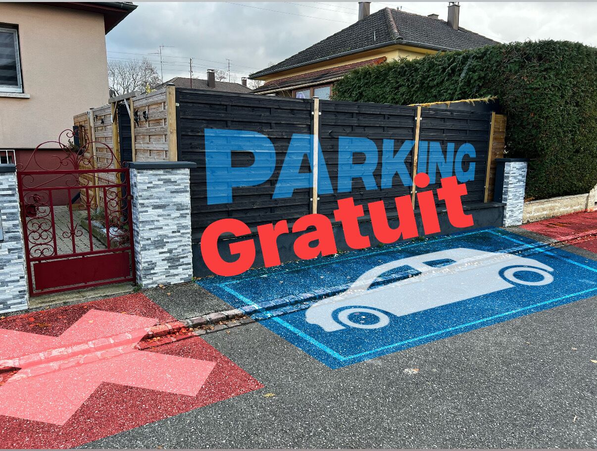 A parking area with a sign indicating free parking.