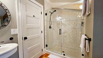 Shower, hair dryer, towels, soap