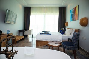 Comfort Room, Balcony, Pool View | Minibar, in-room safe, desk, soundproofing