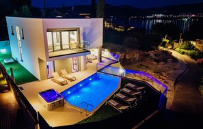 A modern house with a swimming pool, outdoor seating, and a hot tub. - Gorgeous home in Arbanija (Arbanija)