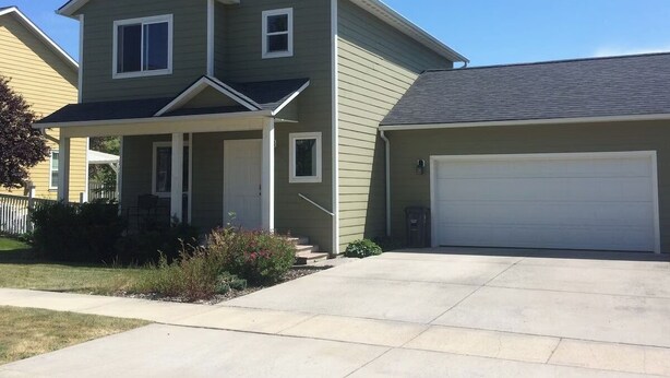 A two-story house with a garage, a covered porch, and a front yard. - The Lighthouse - Entire home in Moscow, Idaho (Moscow)