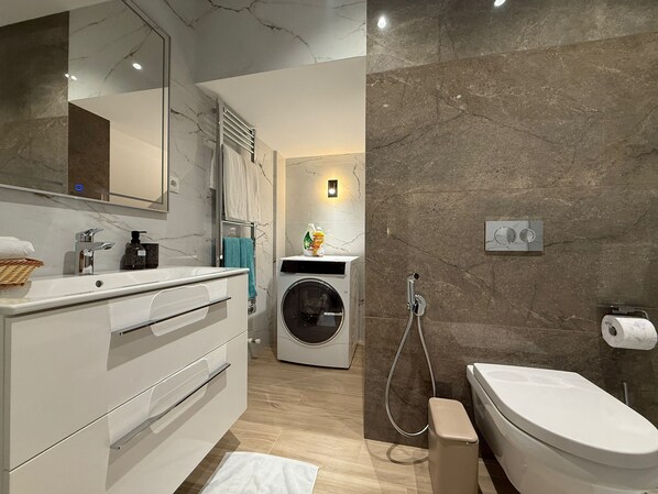Hair dryer, bidet, towels, soap