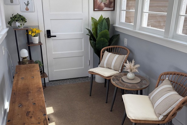 Beautifully decorated breezeway/sunroom to enjoy a book or cup of coffee.